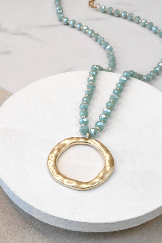 Beaded Necklace with Gold Tone Circle Pendant Aqua